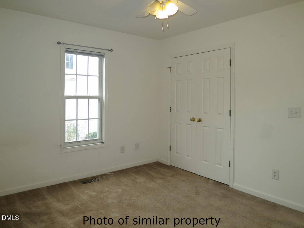 300 Davie Road Carrboro, NC 27510 - Photo 11 of 16 an empty room with a window