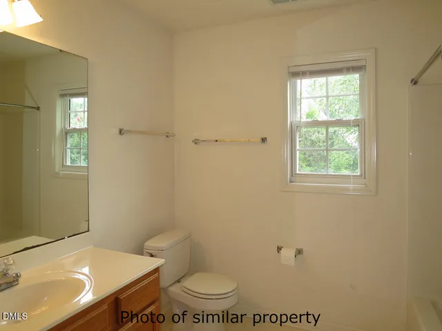 a bathroom with a toilet and a sink