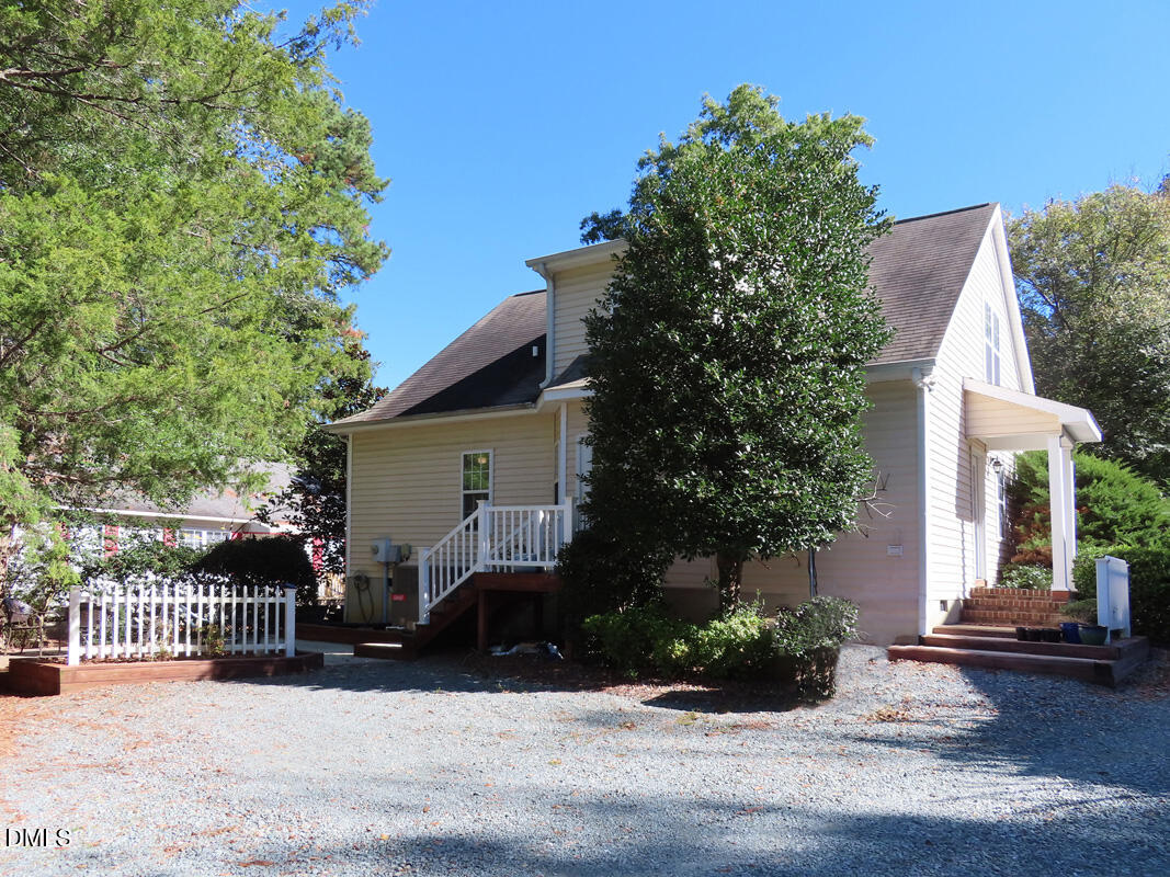 300 Davie Road Carrboro, NC 27510 - Photo 16 of 16 a view of a house with a patio