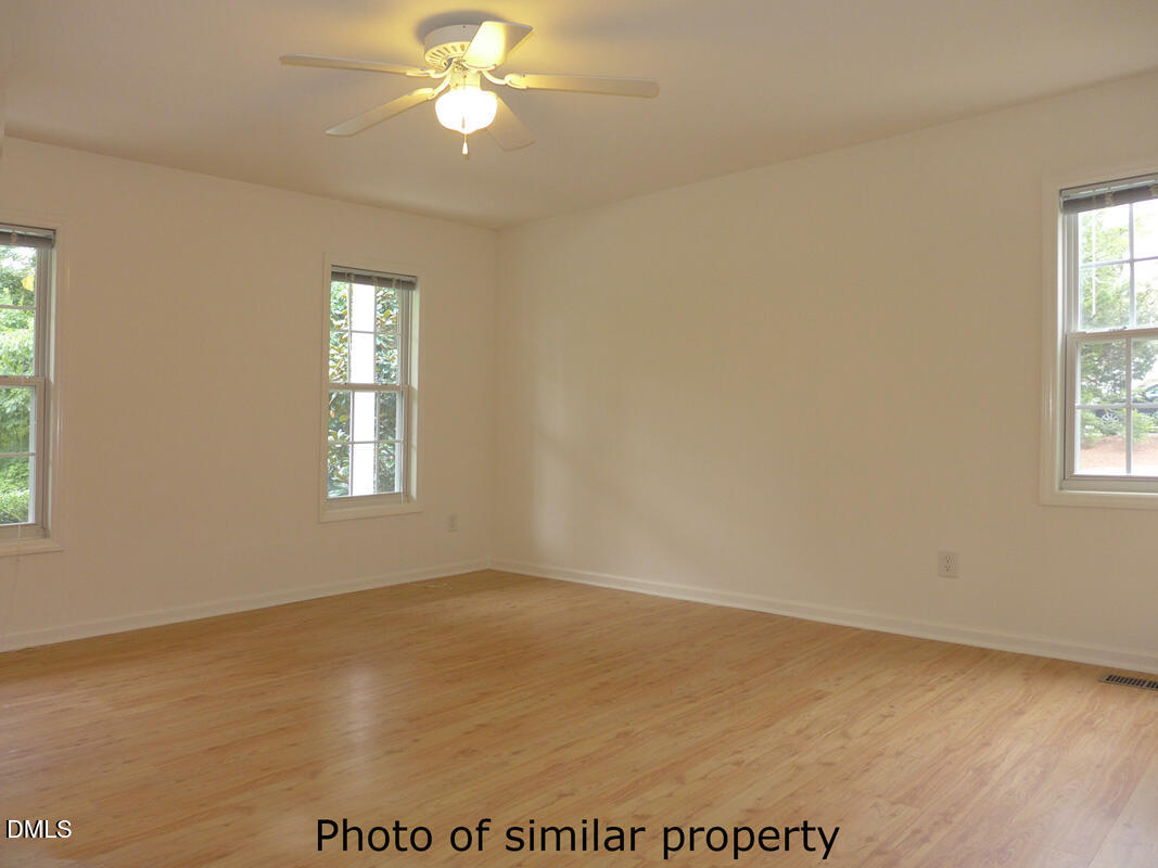 300 Davie Road Carrboro, NC 27510 - Photo 5 of 16 a view of wooden floor and windows in a room