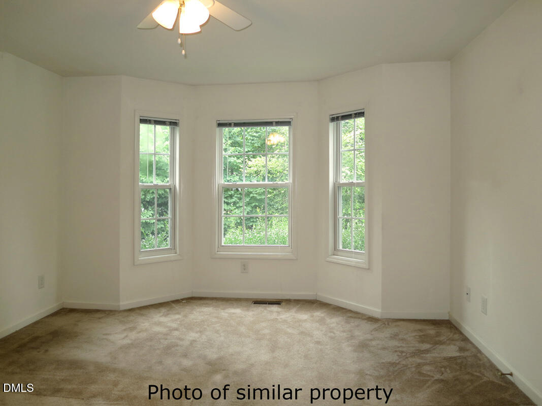 300 Davie Road Carrboro, NC 27510 - Photo 10 of 16 an empty room with windows
