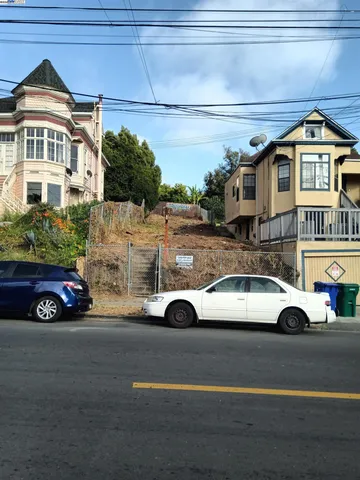 a view of a car parked in front of a house