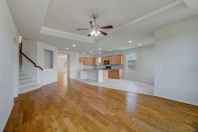 a view of kitchen with kitchen island microwave and stove
