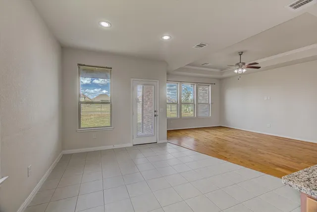 a kitchen with stainless steel appliances granite countertop a refrigerator sink and cabinets