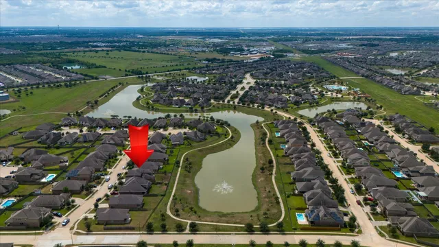 an aerial view of a houses with outdoor space