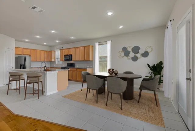 a living room with furniture large window and flat screen tv