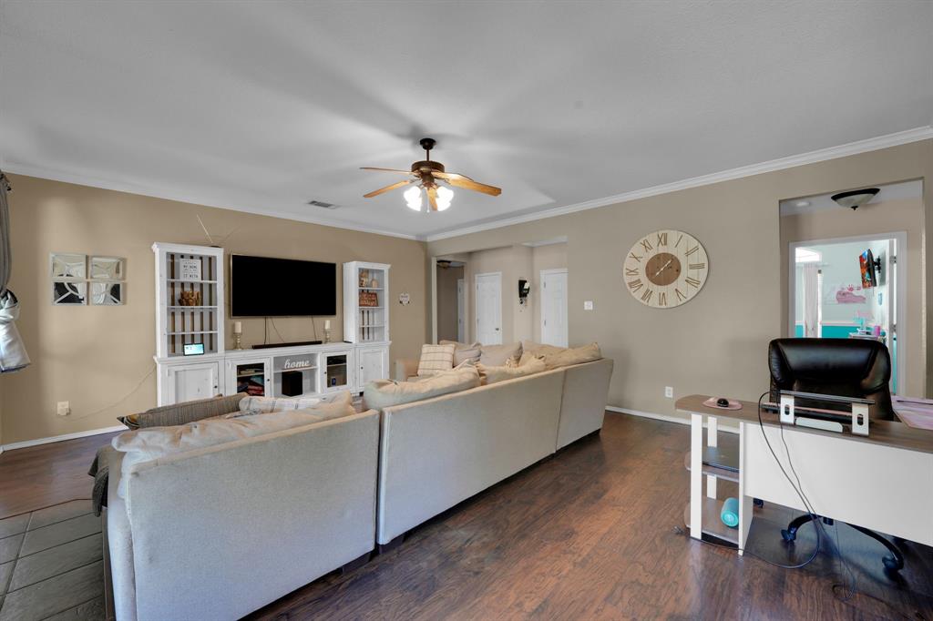 951 Behrens Court Crowley, TX 76036 - Photo 24 of 37 a living room with furniture and a flat screen tv