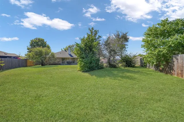 a view of a garden and basketball court