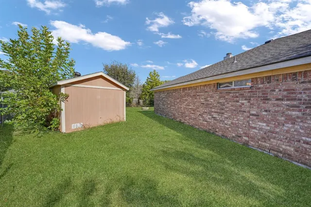 a backyard of a house with lots of green space