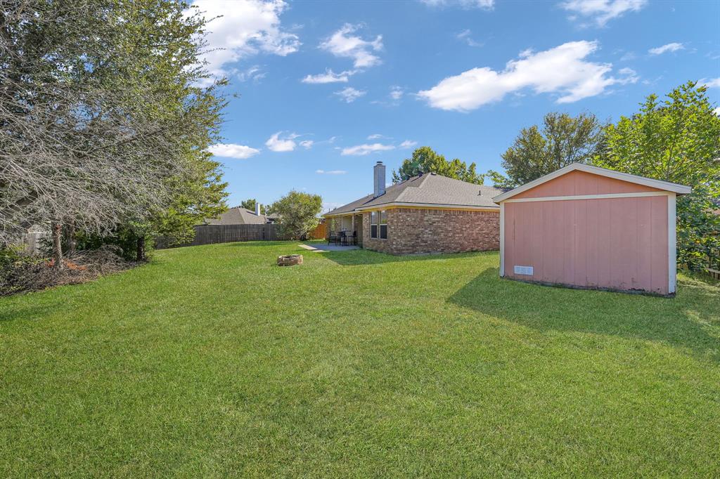 951 Behrens Court Crowley, TX 76036 - Photo 34 of 37 a view of a house with a yard