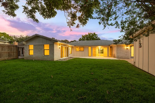 a view of a big yard next to a house