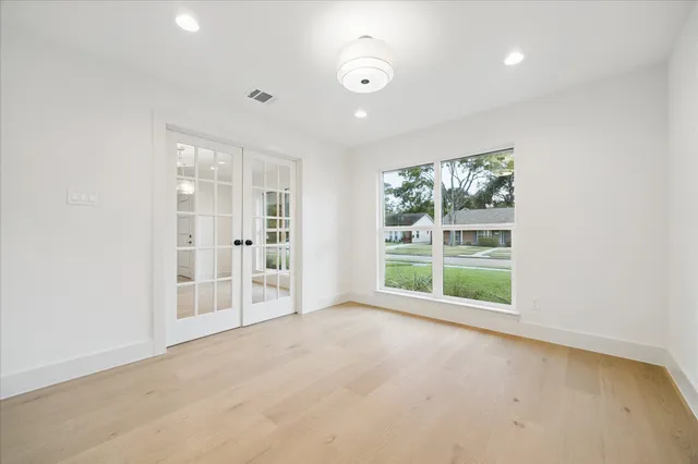 an empty room with windows and view