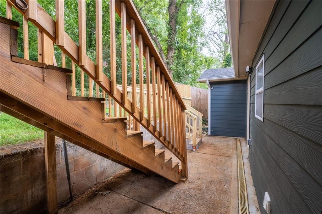 965 Houston Mill Road Northeast Atlanta, GA 30329 - Photo 37 of 42 a view of staircase with railing and white walls