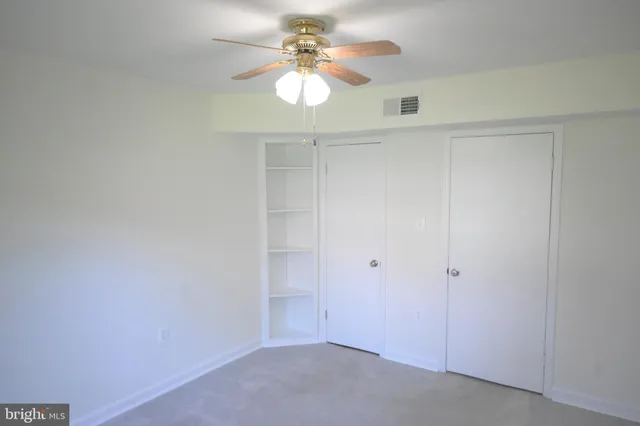 a view of an empty walk in closet