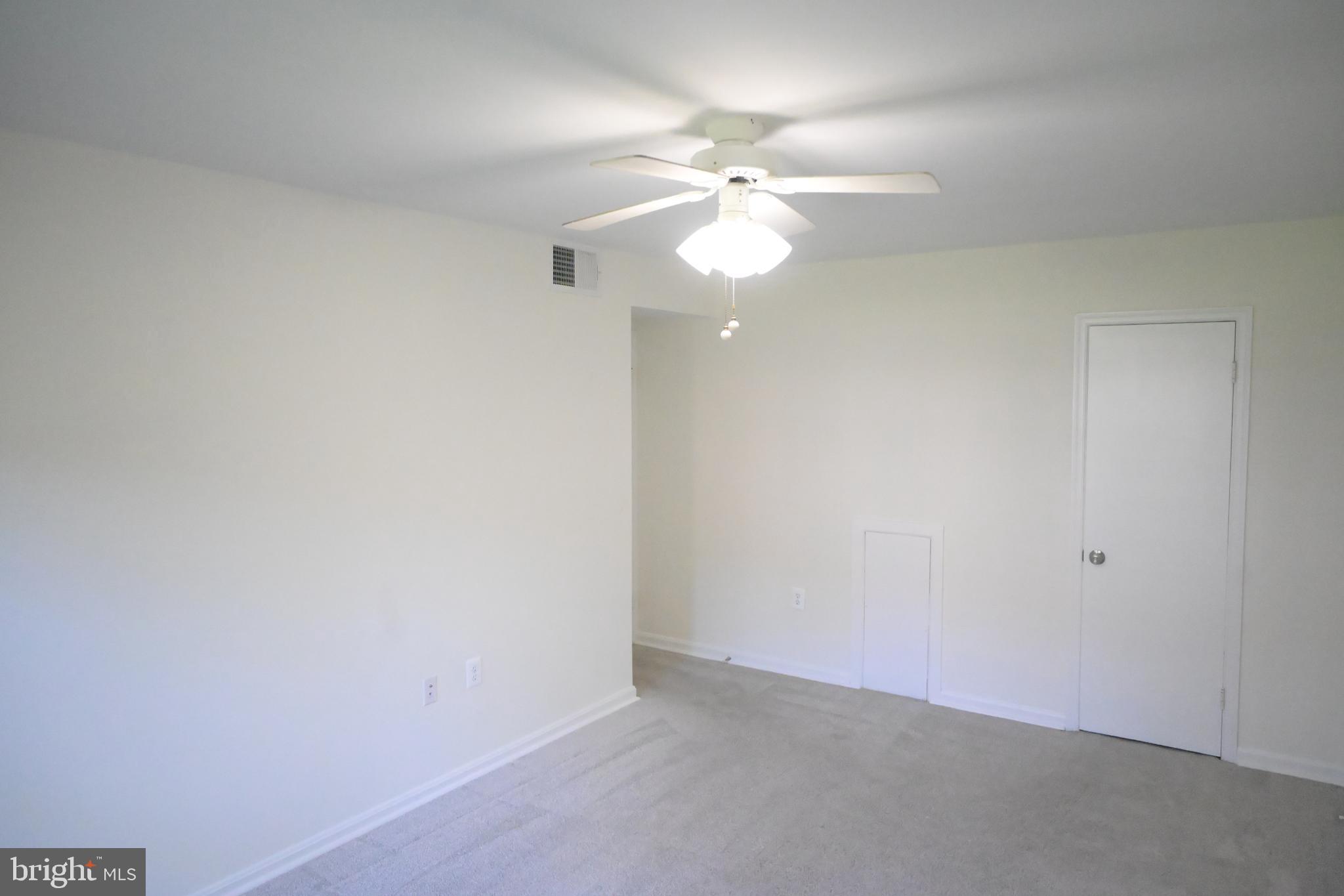 9451 Fairfax Boulevard, Unit 102 Fairfax, VA 22031 - Photo 19 of 26 an empty room with a fan and a fan
