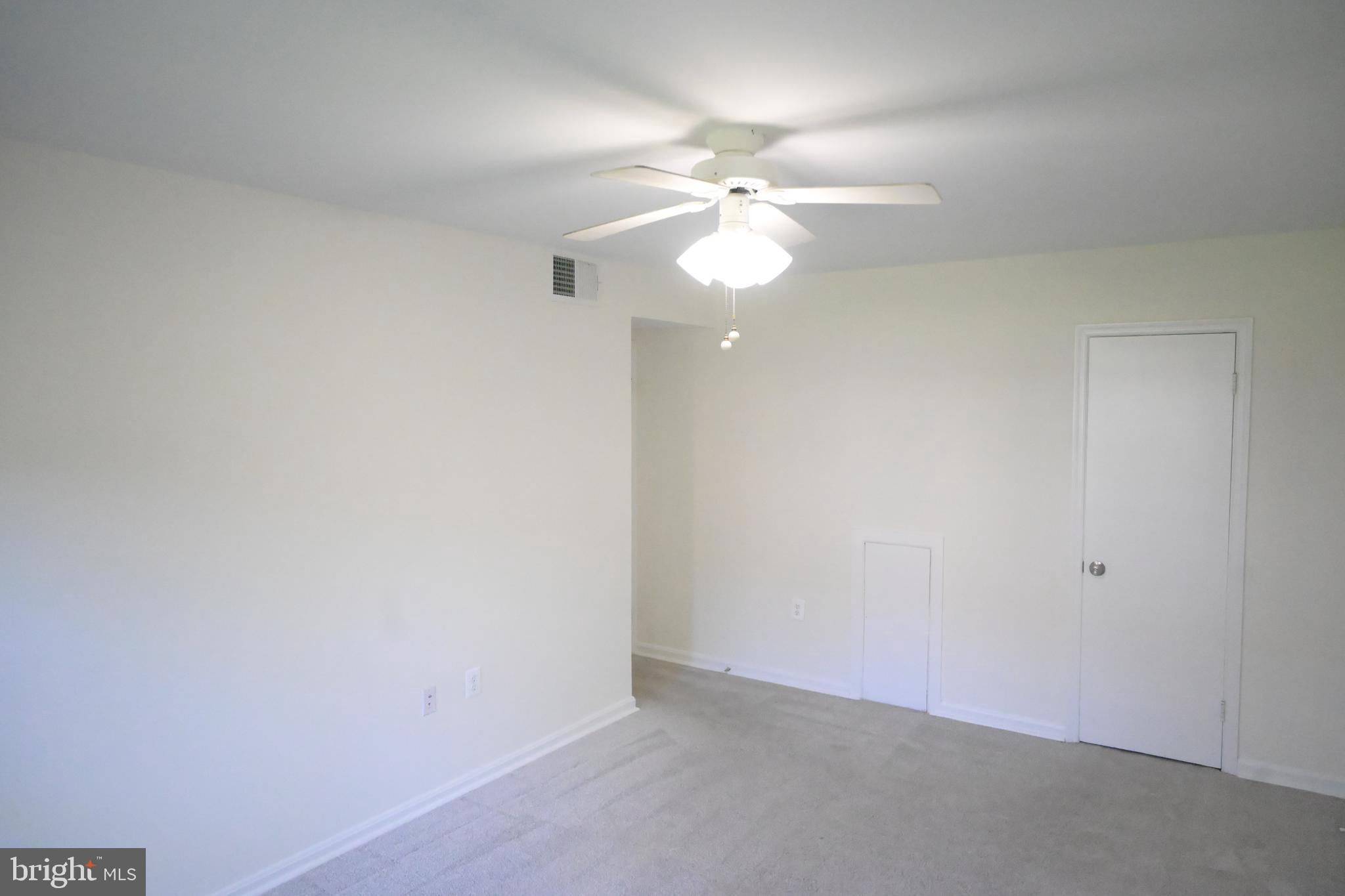 9451 Fairfax Boulevard, Unit 102 Fairfax, VA 22031 - Photo 20 of 26 an empty room with a fan and a fan