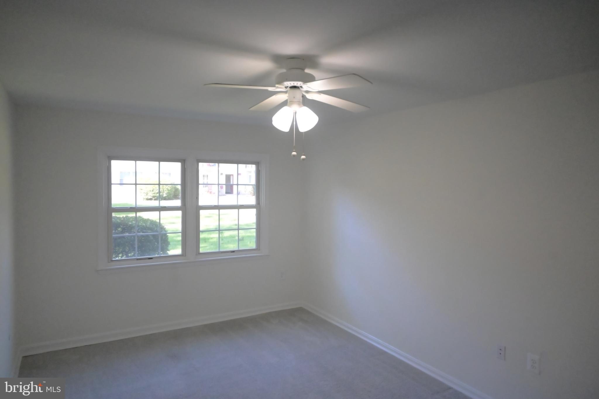 9451 Fairfax Boulevard, Unit 102 Fairfax, VA 22031 - Photo 21 of 26 an empty room with a window and a fan
