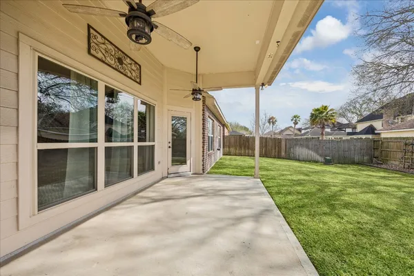 a view of a house with backyard and a garden