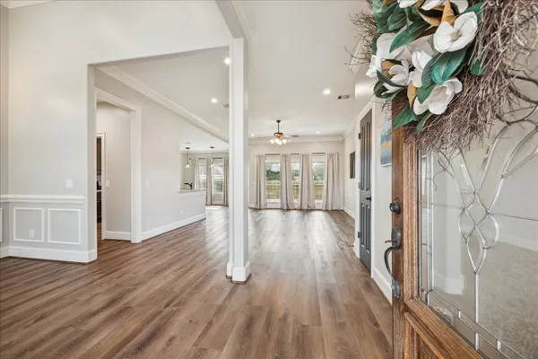 a view of a hallway with wooden floor