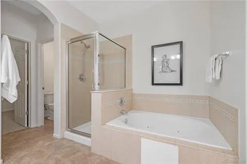 a white bath tub sitting next to a bathroom