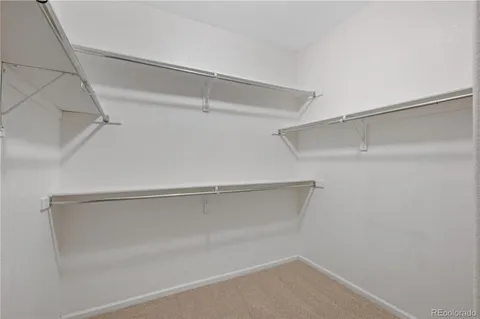 a view of an empty walk in closet