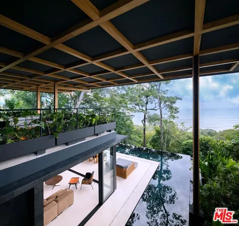 a view of swimming pool with a patio