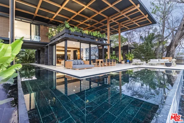 a view of a backyard with sitting area