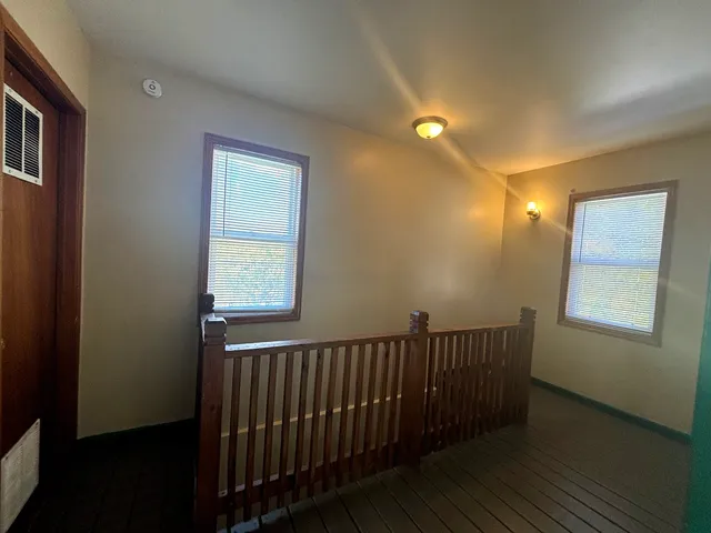 a view of entryway with wooden floor