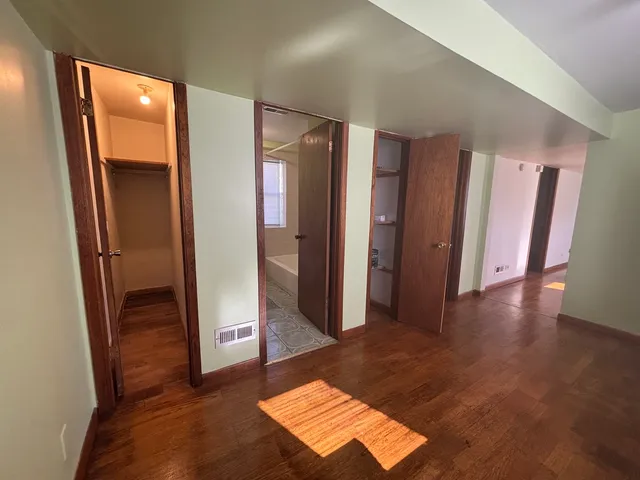 a view of entryway with wooden floor