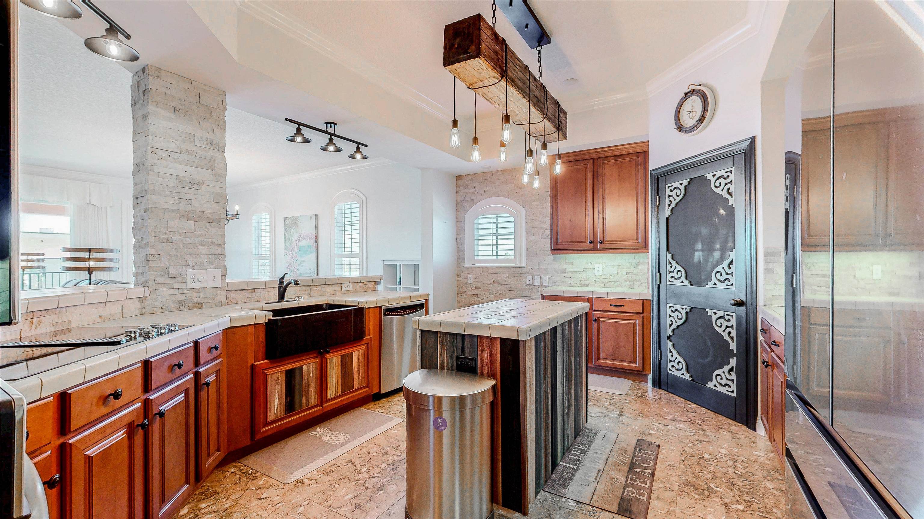 115 Sunset Harbor Way, Unit 303 St. Augustine, FL 32080 - Photo 21 of 76 a kitchen with a sink a refrigerator a washer and dryer