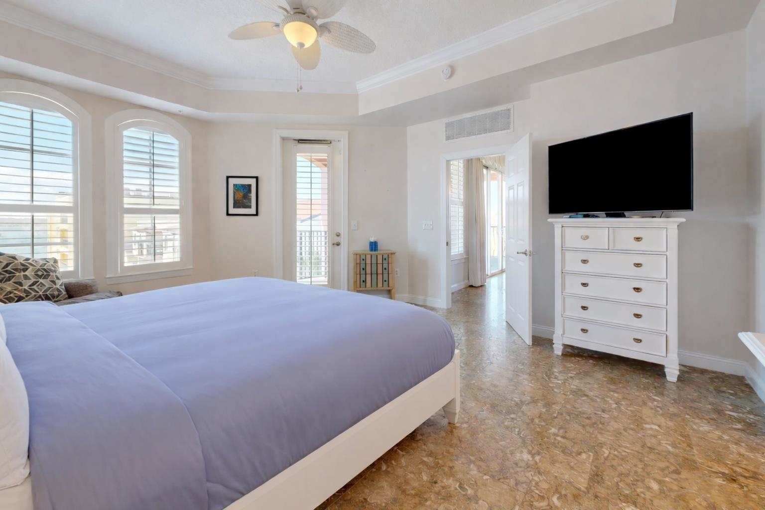 115 Sunset Harbor Way, Unit 303 St. Augustine, FL 32080 - Photo 23 of 76 a bedroom with a bed and flat screen tv