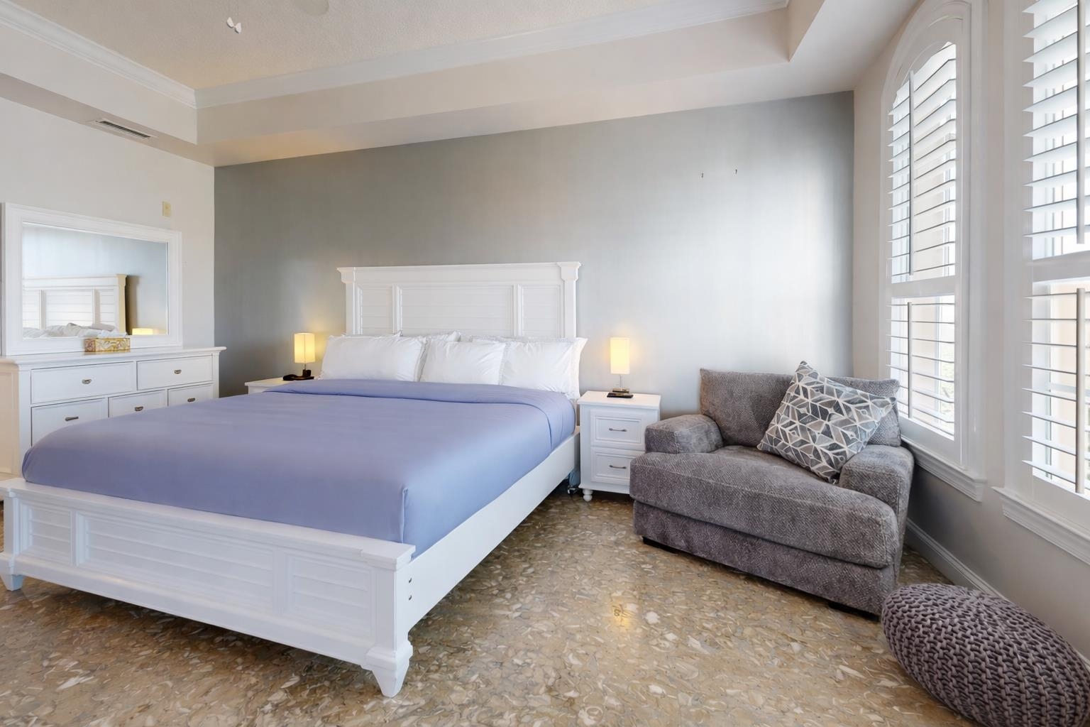 115 Sunset Harbor Way, Unit 303 St. Augustine, FL 32080 - Photo 26 of 76 a spacious bedroom with a bed and a couch