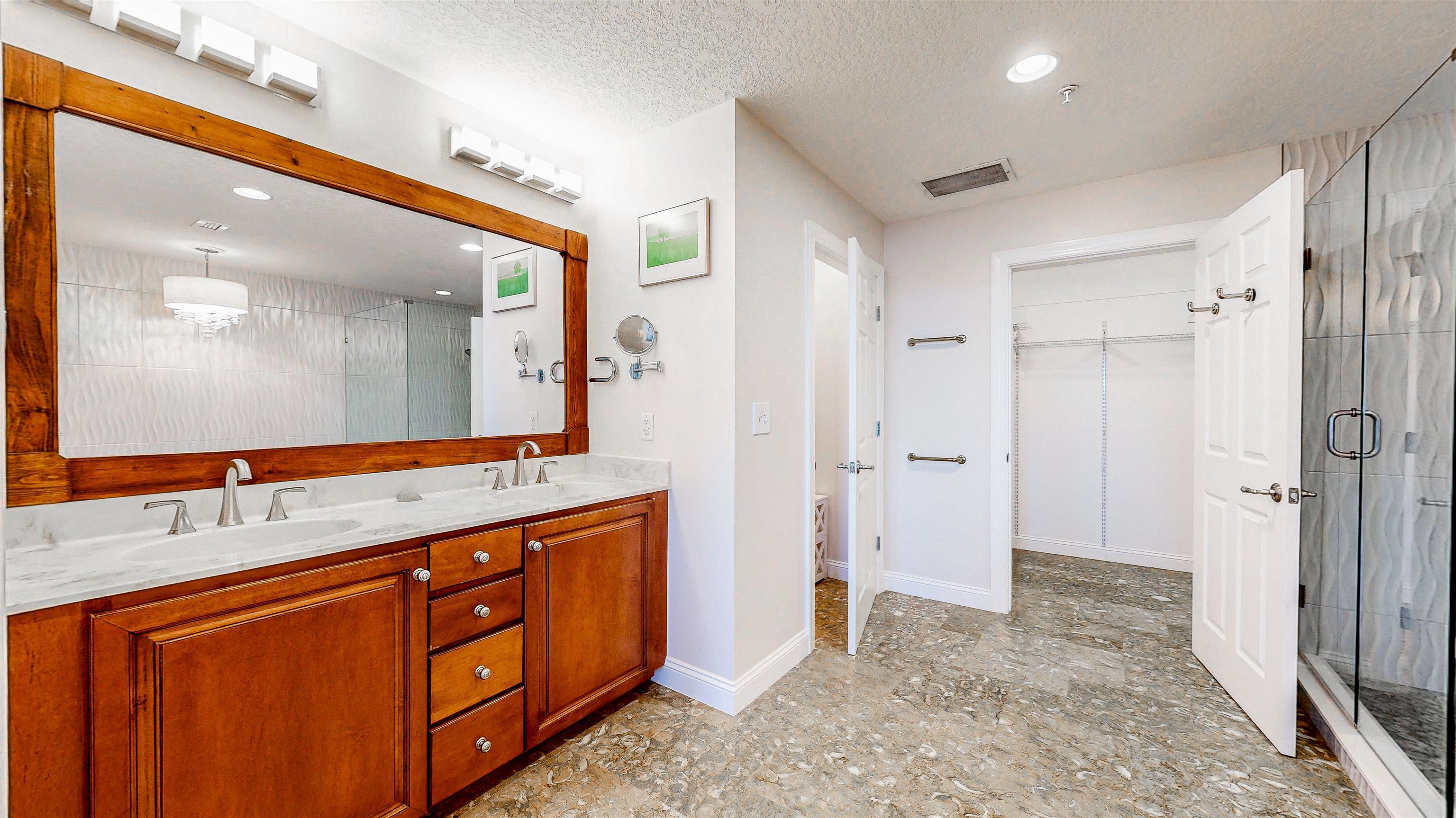 115 Sunset Harbor Way, Unit 303 St. Augustine, FL 32080 - Photo 29 of 76 a bathroom with a granite countertop sink mirror and a