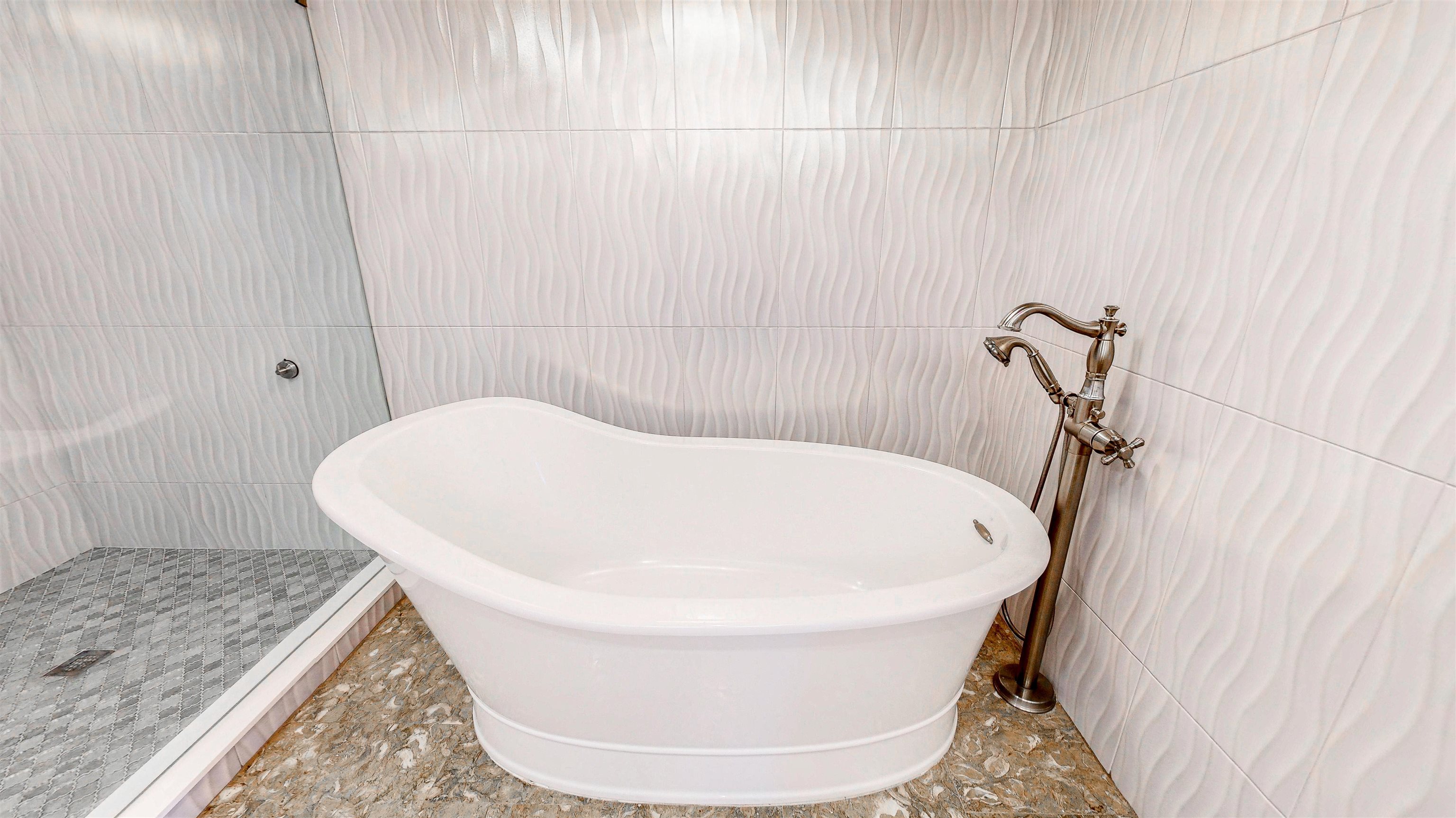 115 Sunset Harbor Way, Unit 303 St. Augustine, FL 32080 - Photo 31 of 76 a bathroom with a bathtub