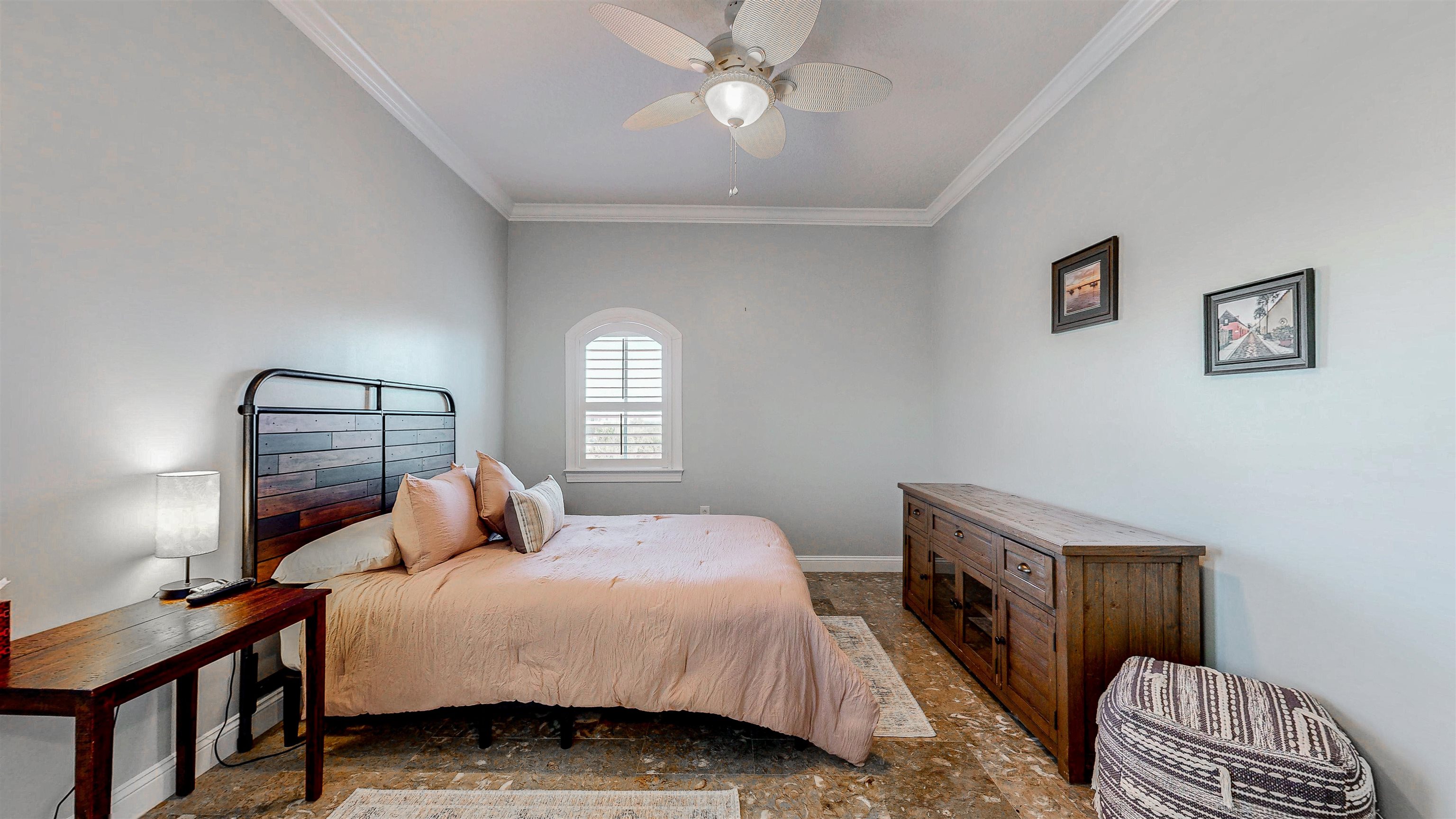 115 Sunset Harbor Way, Unit 303 St. Augustine, FL 32080 - Photo 36 of 76 a bedroom with a bed a chandelier and a window