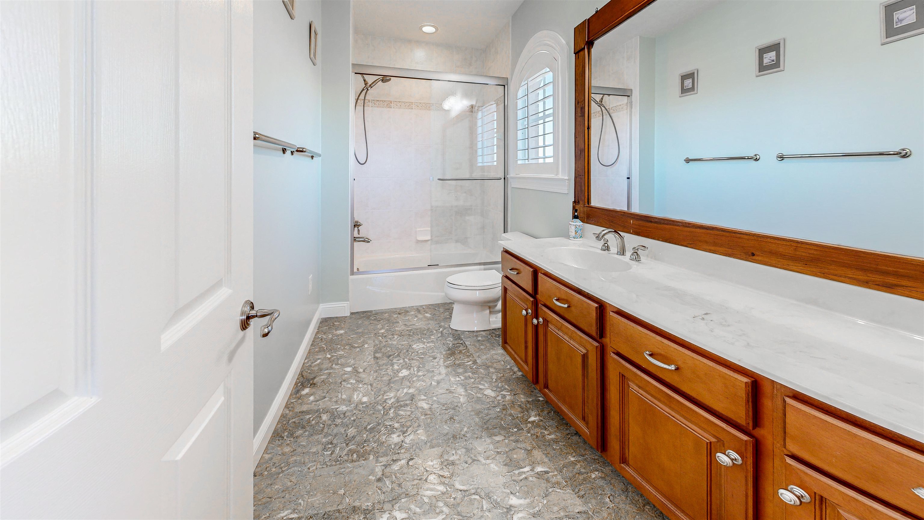 115 Sunset Harbor Way, Unit 303 St. Augustine, FL 32080 - Photo 39 of 76 a bathroom with a sink a toilet and shower