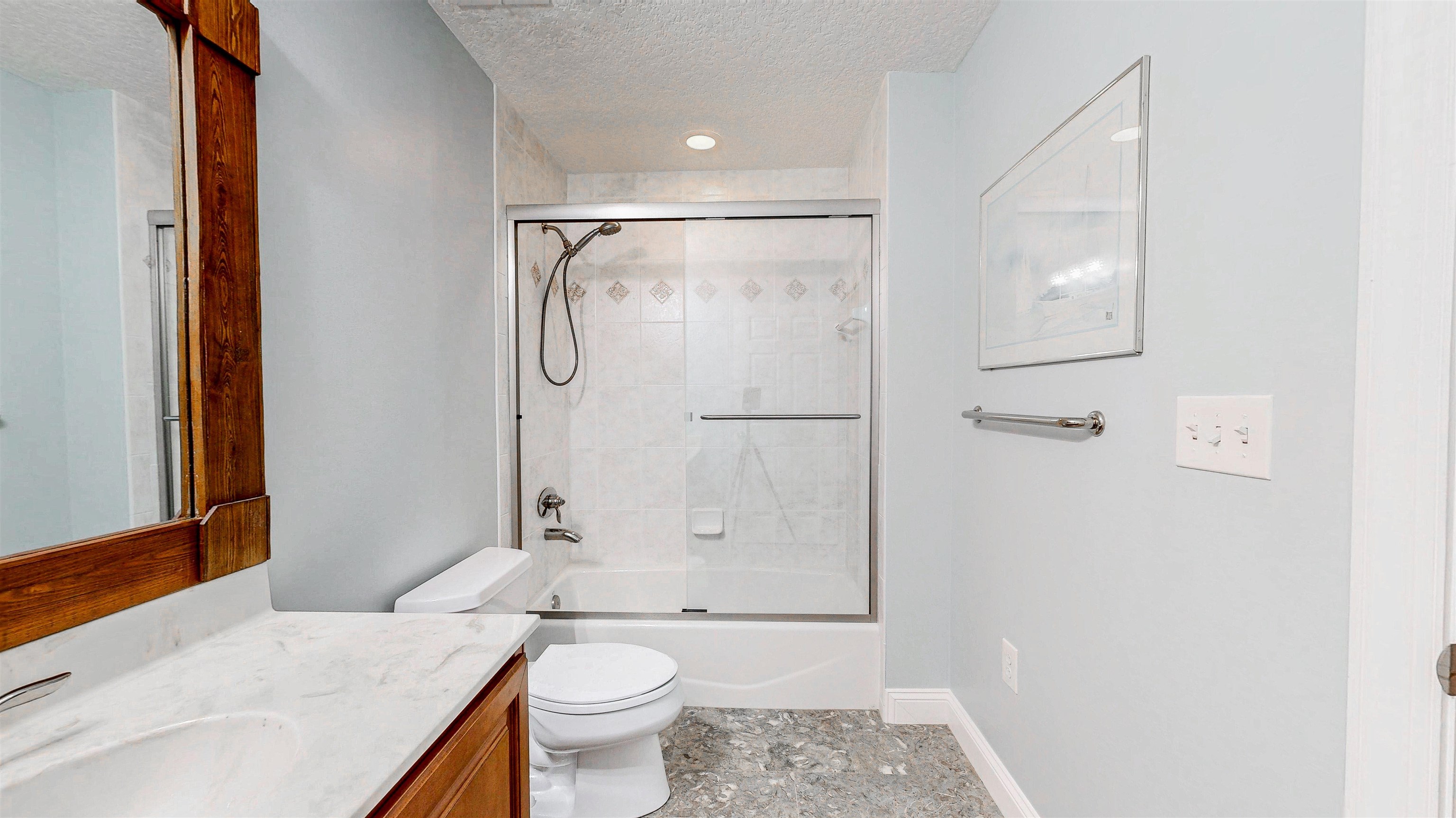 115 Sunset Harbor Way, Unit 303 St. Augustine, FL 32080 - Photo 46 of 76 a bathroom with a granite countertop sink toilet and shower