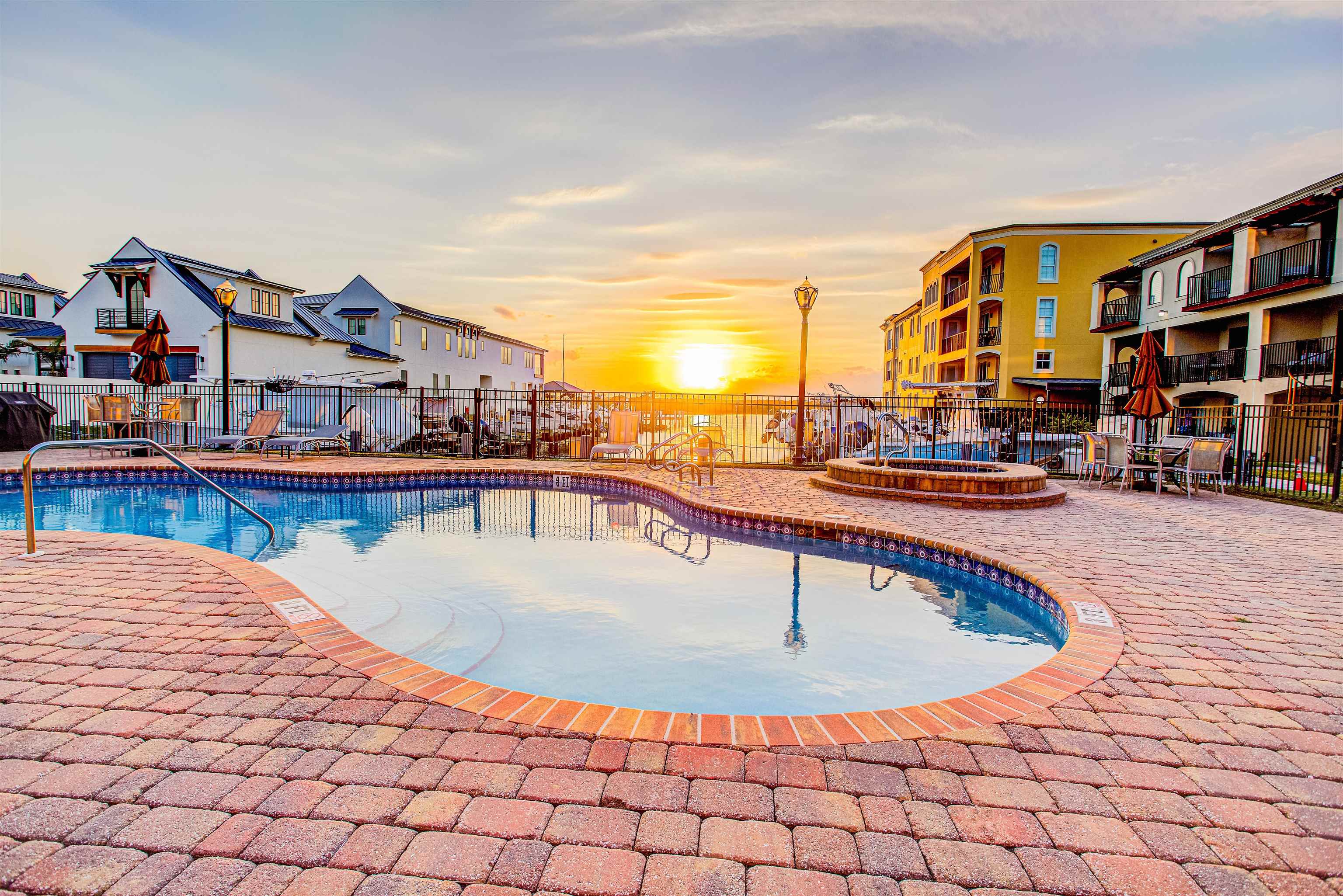 115 Sunset Harbor Way, Unit 303 St. Augustine, FL 32080 - Photo 62 of 76 a view of a swimming pool with a lounge chairs