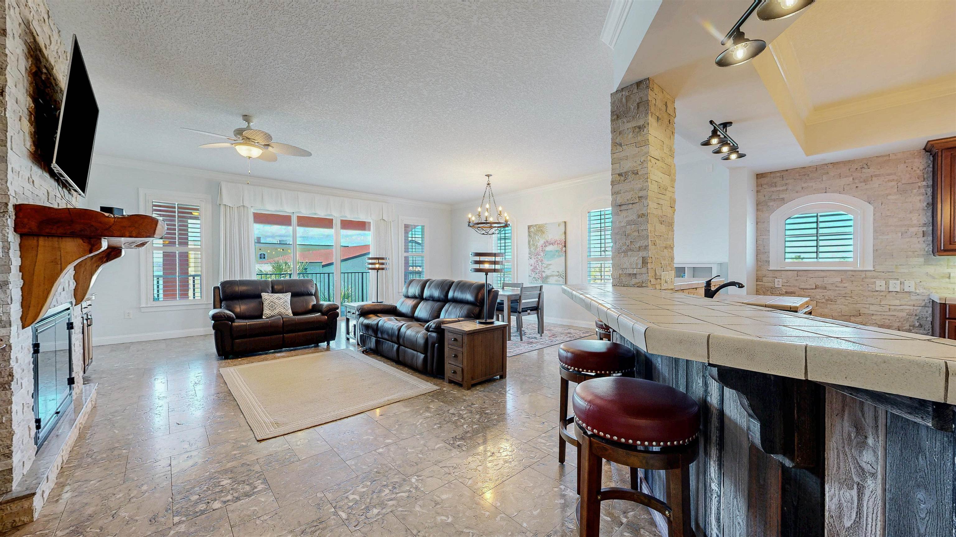 115 Sunset Harbor Way, Unit 303 St. Augustine, FL 32080 - Photo 8 of 76 a living room with furniture a window and a flat screen tv