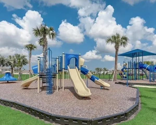 a living room with furniture a flat screen tv and a window