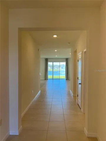 a kitchen with kitchen island granite countertop a stove and a sink