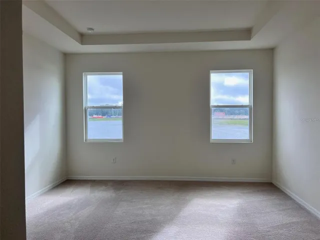 a bathroom with a granite countertop toilet and a shower