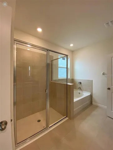 a view of storage and utility room with washer and dryer