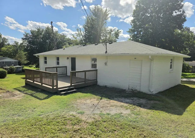 a view of a backyard with a small cabin