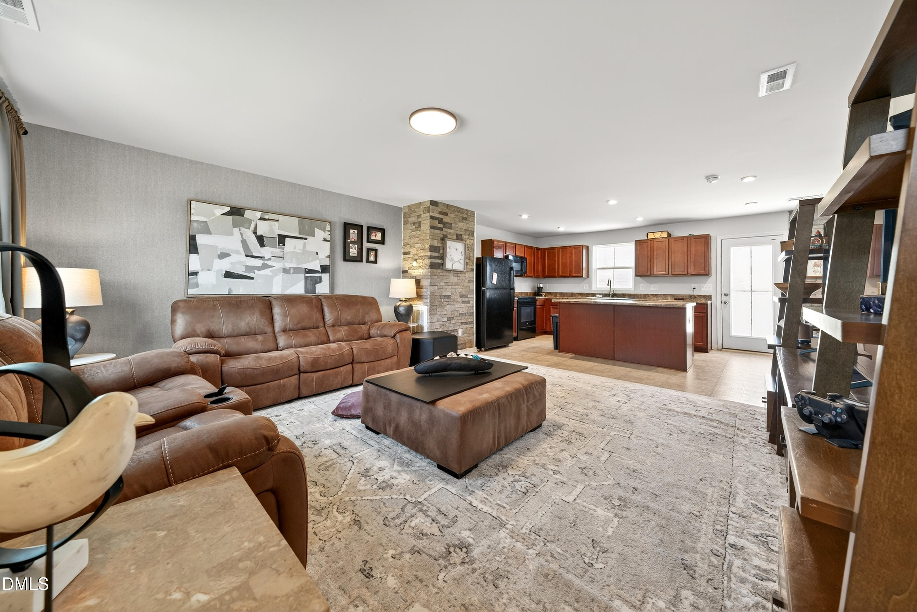 125 Donatella Way Angier, NC 27501 - Photo 2 of 10 a living room with furniture and a flat screen tv