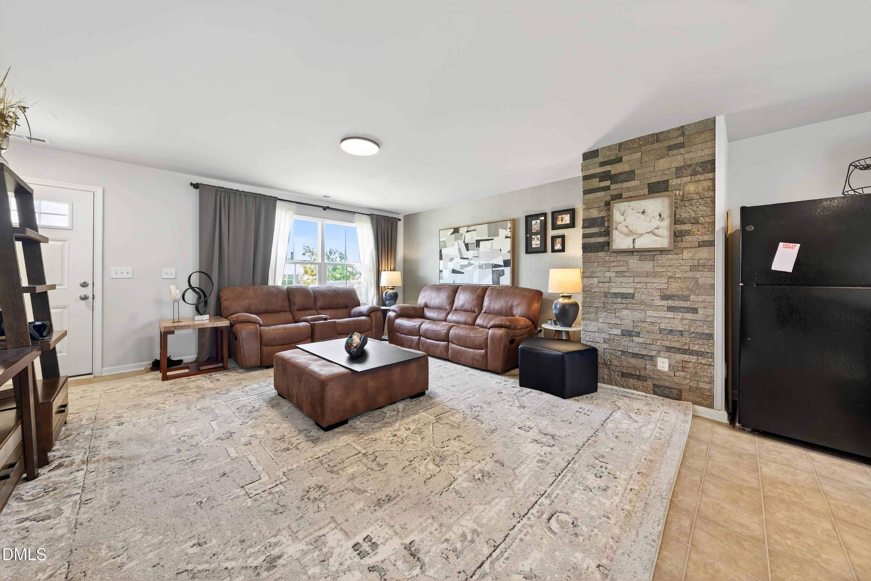 125 Donatella Way Angier, NC 27501 - Photo 3 of 10 a living room with furniture rug and window