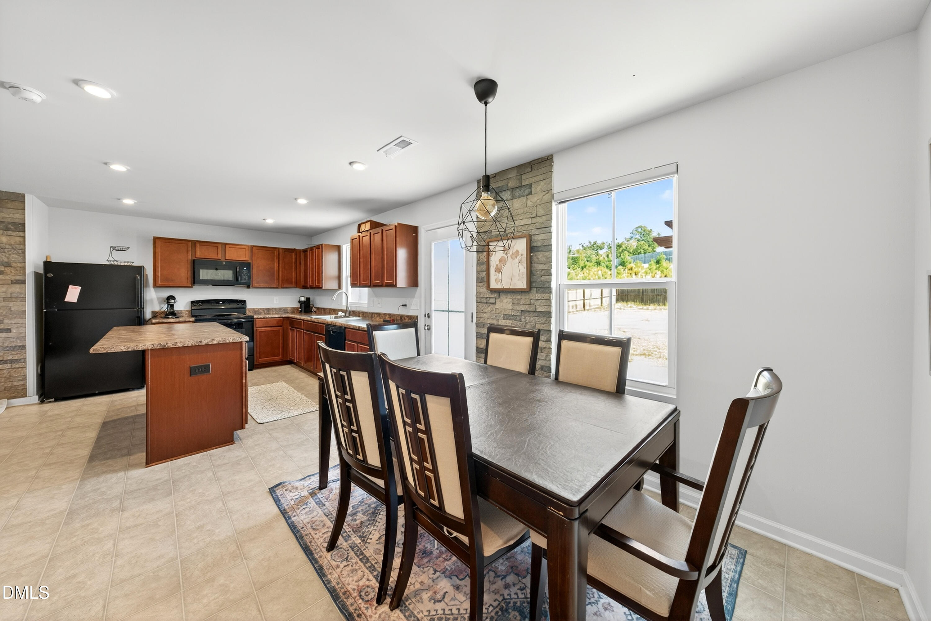 125 Donatella Way Angier, NC 27501 - Photo 5 of 10 a dining room with furniture a window and kitchen view