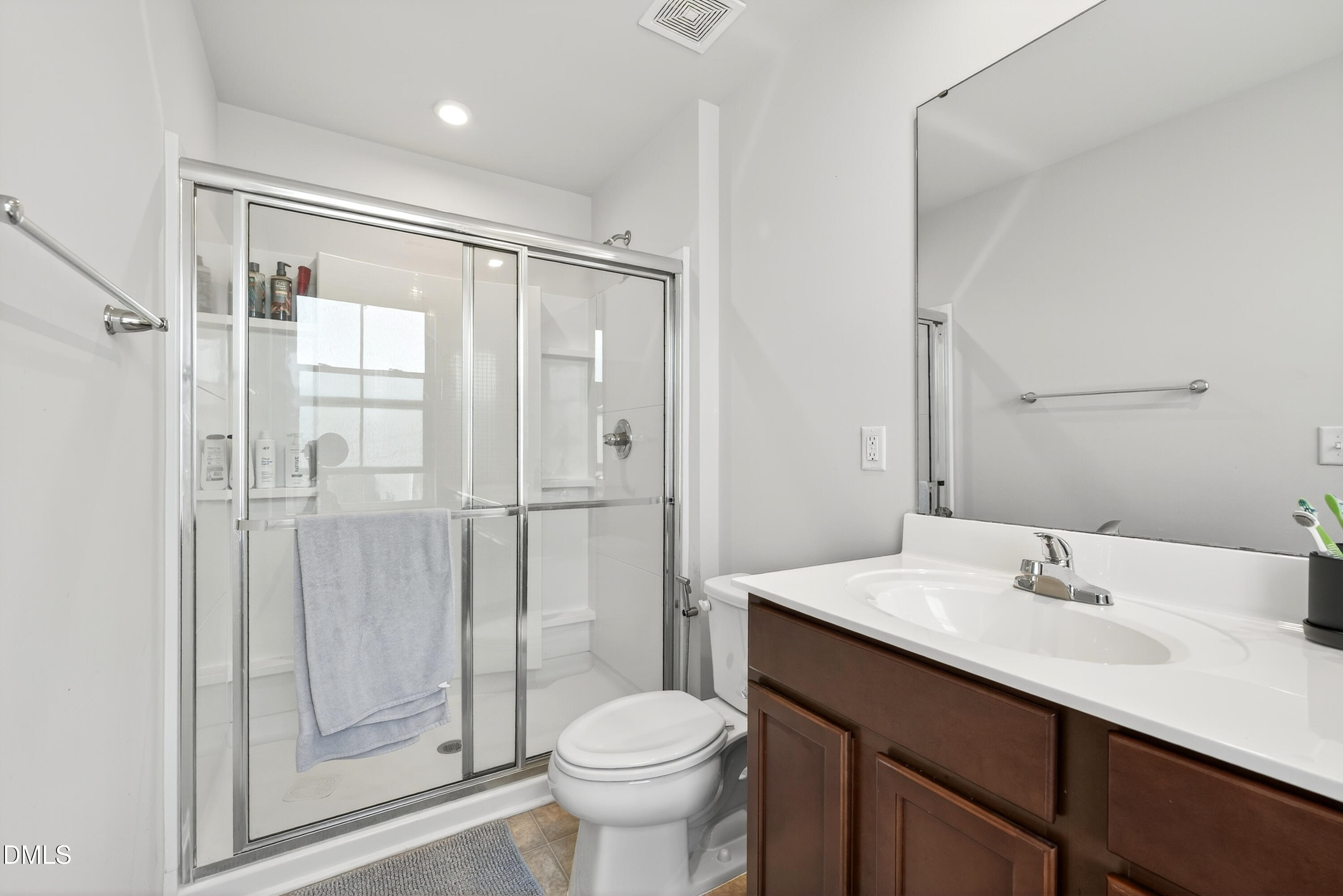 125 Donatella Way Angier, NC 27501 - Photo 8 of 10 a bathroom with a sink toilet and shower