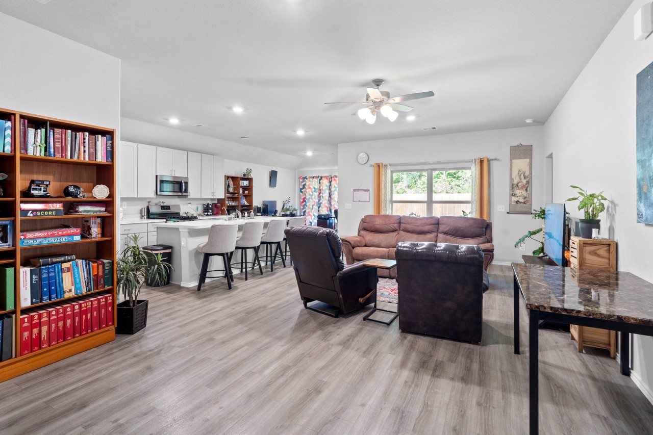 9931 Spring Creek Road Cleveland, TX 77327 - Photo 2 of 38 Upon entering you will find the open concept living/kitchen/dining/breakfast nook.