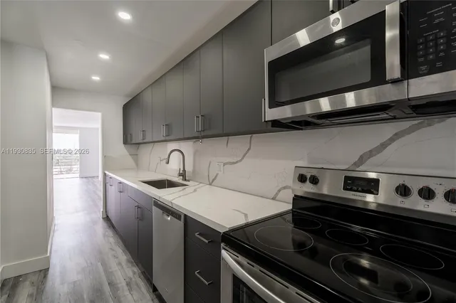 a kitchen with a stove and a microwave